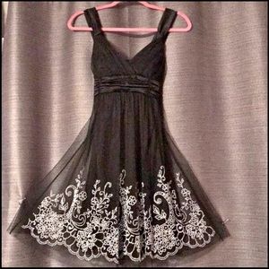 Small embroidered beaded Taboo party dress